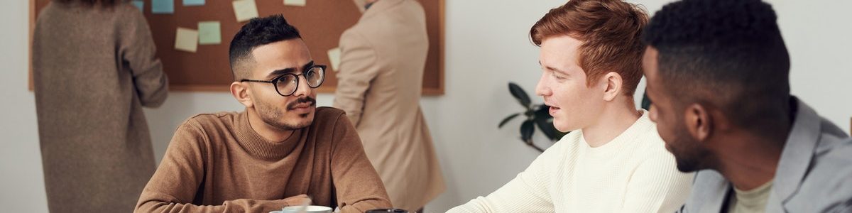 Diverse group of business people seated at a conference table