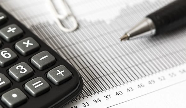 Closeup of calculator and data chart