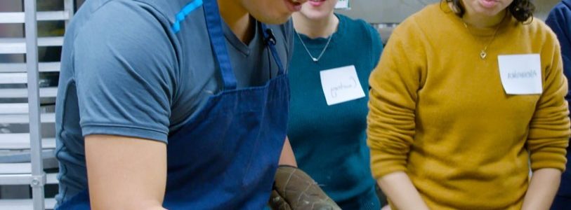 Adrian Espinoza Garcia showing others how to make empanadas.