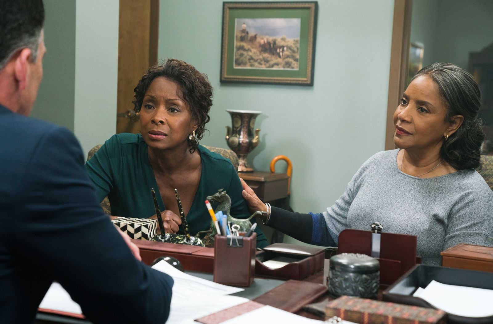 Crystal Fox and Phylicia Rashad talk to an attorney in a scene from Tyler Perry's A Fall From Grace