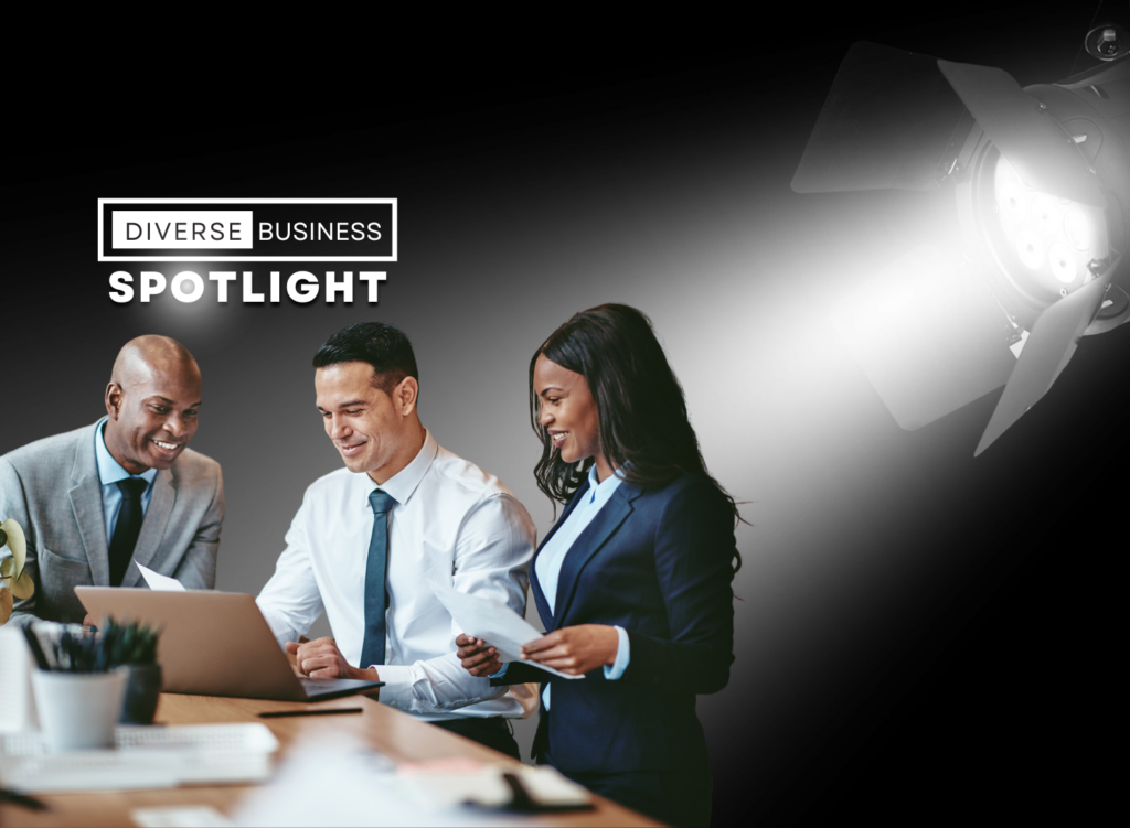 Black man, latino man, and Black woman sitting at a desk reviewing papers while a spotlight in the upper right corner shines on them.