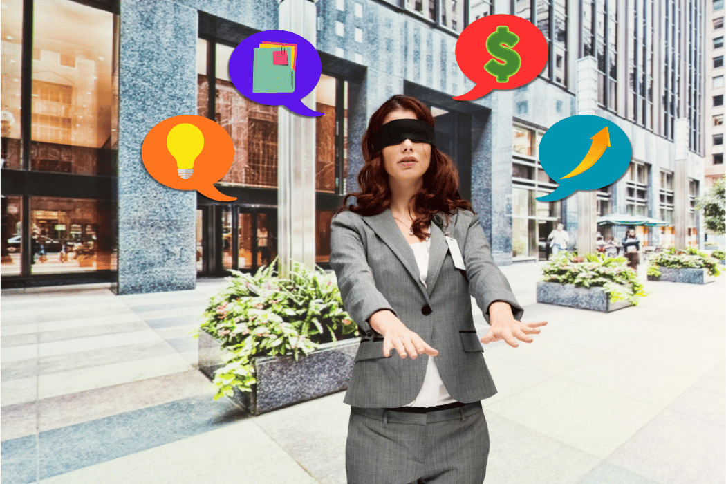 Blindfolded woman standing in front of office building