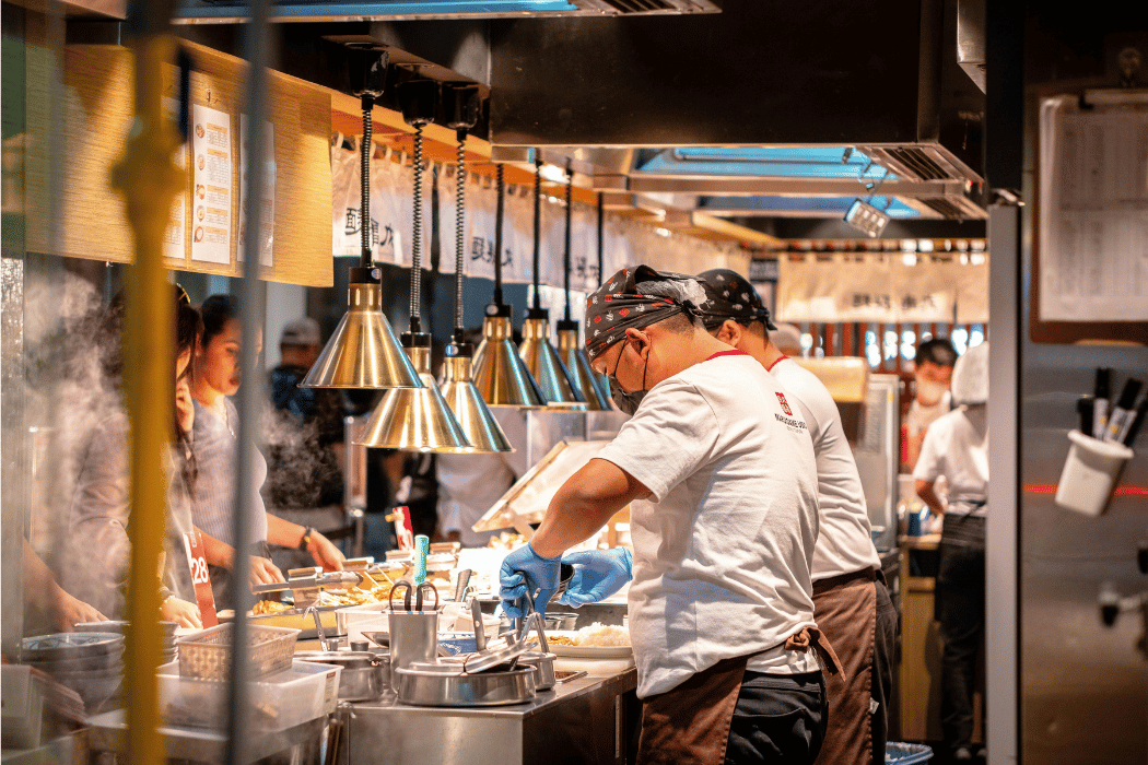 Restaurant workers preparing food