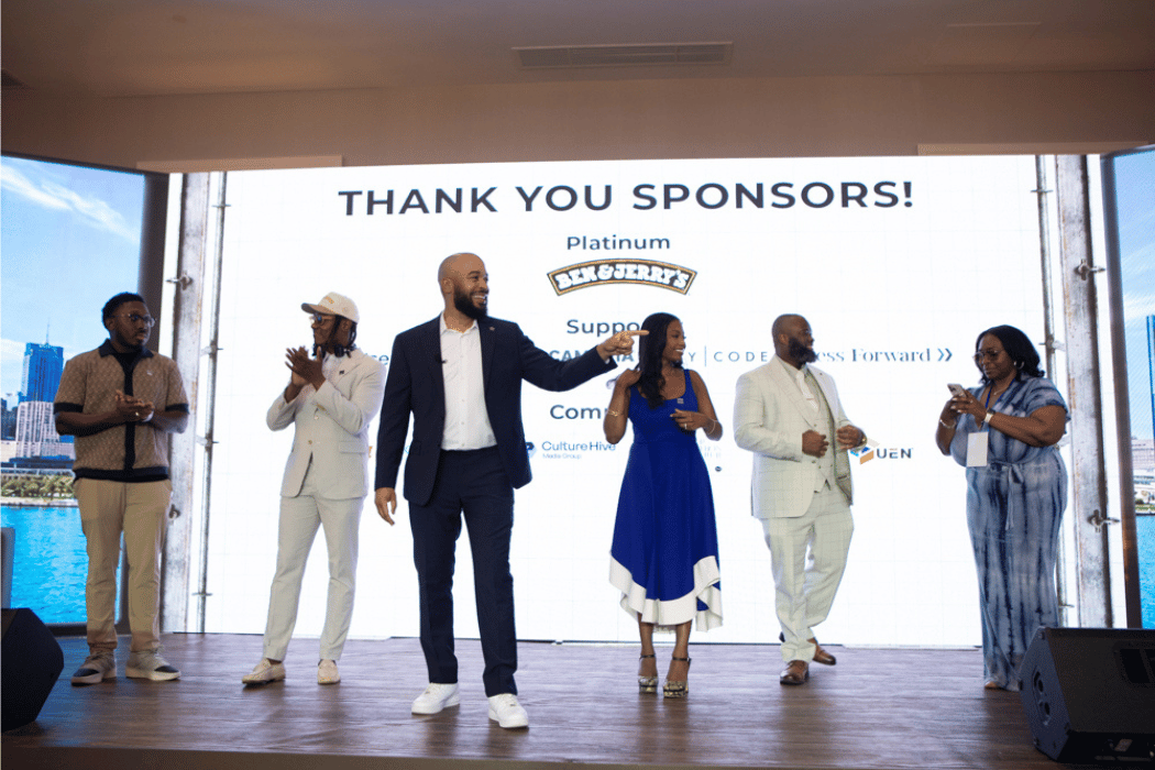BOMESI Summit leaders standing on stage thanking sponsors