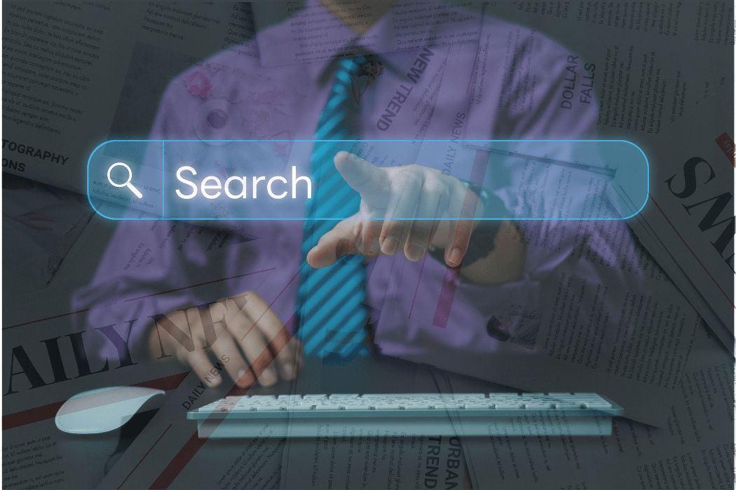 Man typing AI search with newspapers in background