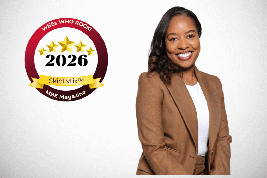 Pretty Black woman smiling in a brown blazer