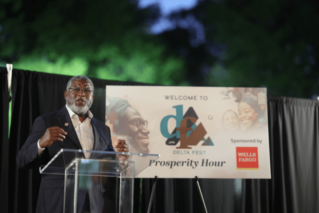 HOPE CEO Bill Bynum standing on stage addresing attendees at Delta Fest