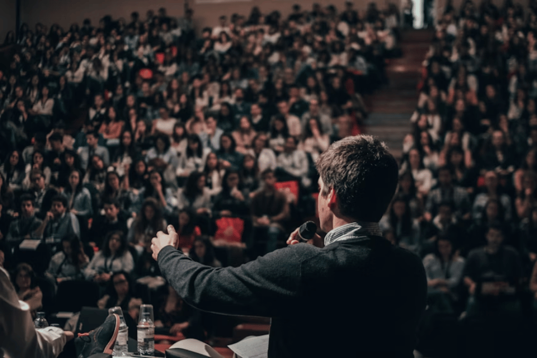 Man speaking to a crowd