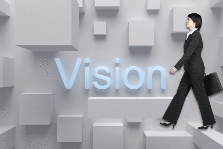 Woman walking on a backdrop that says Vision