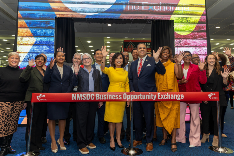 Ying McGuire and other officials of NMSDC cut the ribbon to the Business Opportunity Exchange in 2023