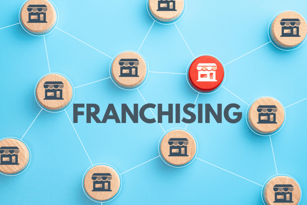 Small wooden pieces representing franchises on a blue background