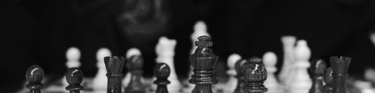 Black and white chess pieces on a board