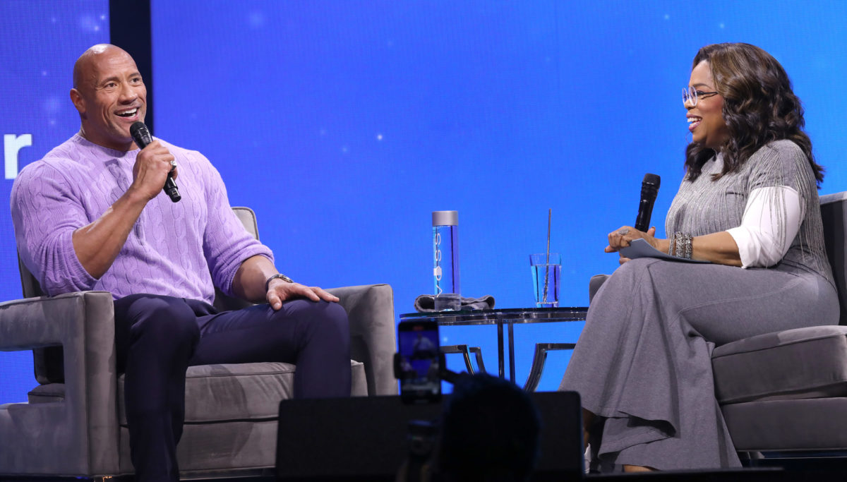 Dwayne "The Rock" Johnson interviewing Oprah Winfrey.