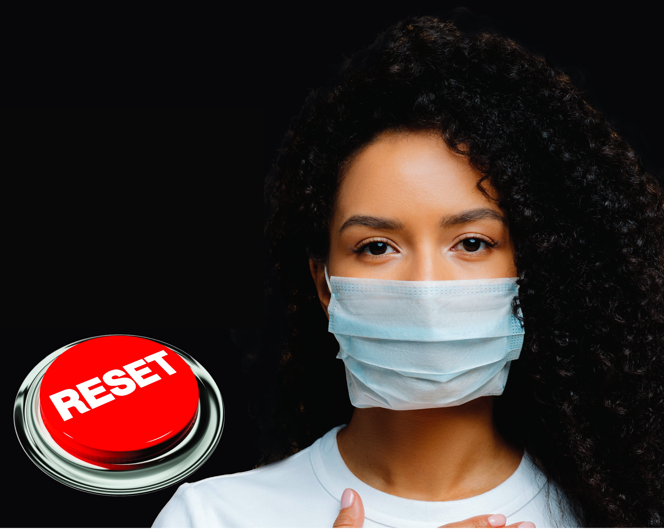 Young woman with surgical mask over her mouth and noise with a red "reset" button on her left.