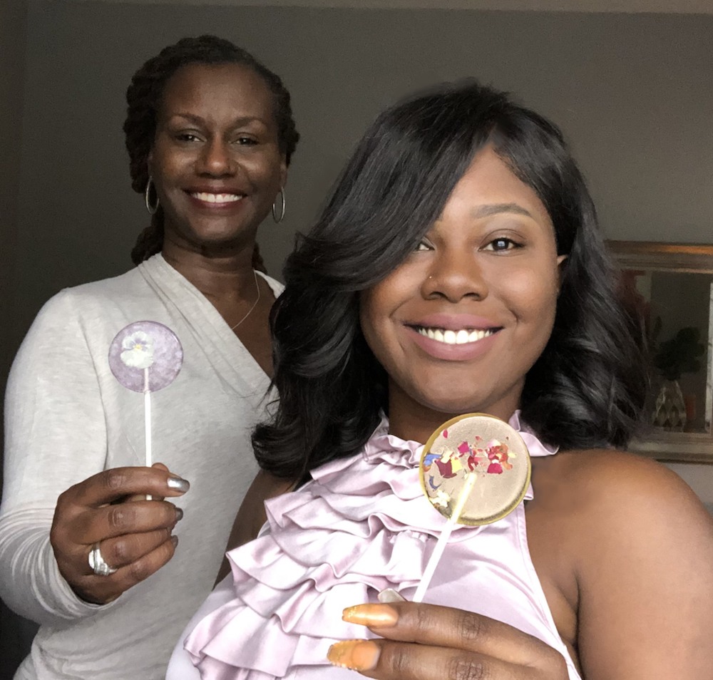 Karen Young and daughter Issa Clark hold Gourmee Bar lollipops.