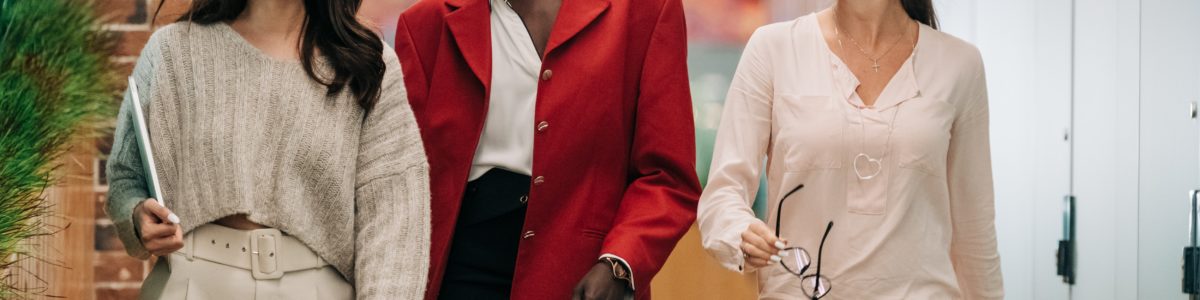 Three businesswomen walking together